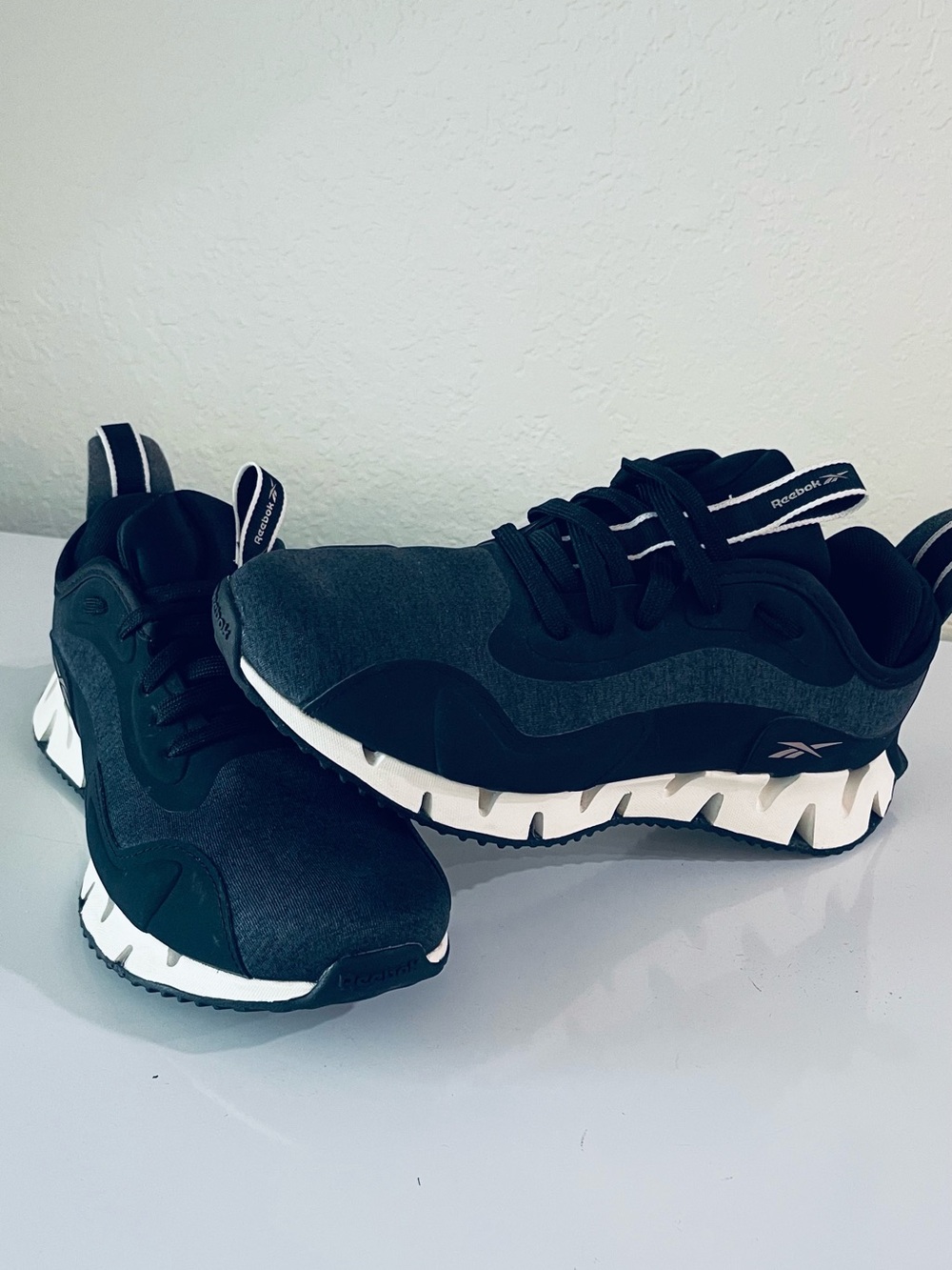 Reebok women’s Black & White Zig-Style Trainer Sneakers
